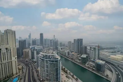 an aerial view of a city with a river and buildings at Luxury 1 Bed Address JBR Direct Beachfront Living in Dubai