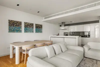 a living room with a couch and a table at Modern 2BDR in Bluewaters Beach&Pool in Dubai