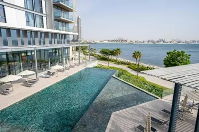 an image of a swimming pool on the side of a building at Modern 2BDR in Bluewaters Beach&Pool in Dubai