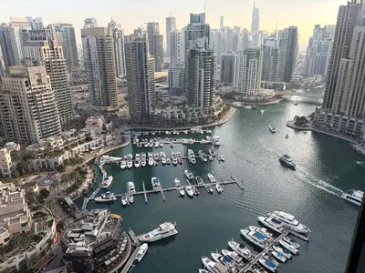 a group of boats docked in a harbor in a city at Marina Gate, Full Marina View, Excellent Location, Dubai Marina in Dubai Marina