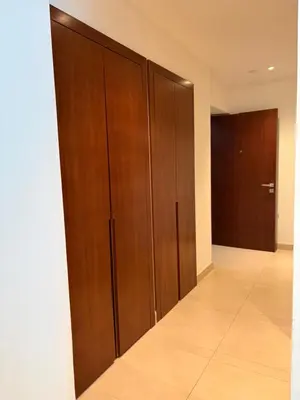 a corridor with wooden cabinets and a hallway with a door at Marina Gate, Full Marina View, Excellent Location, Dubai Marina in Dubai Marina