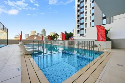 a swimming pool on the roof of a building at Aura by Grovy 405 - Parking, Pool&Gym - by Rentujemy in Dubai