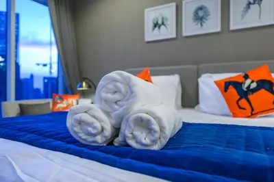 a hotel room with towels on a bed at Luxury Apartment with canal view - near to Burj Khalifa - Dubai in Dubai
