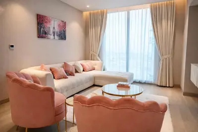 a living room with a couch and two chairs at Marina View 2BHK Luxury in Dubai