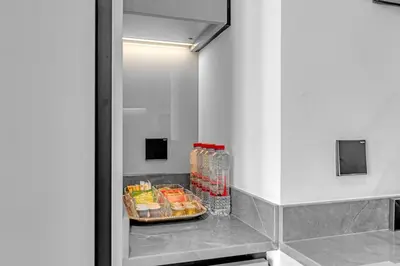 a refrigerator with some food and drinks in it at Waves - Chic Business Bay 1BR - Bright and Modern in Dubai