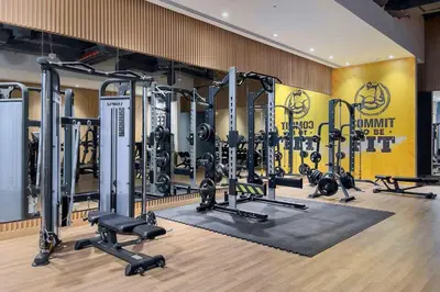a gym with a lot of treadmills and weights at Seven Palm Elite 1BR-Infinity Pool & Skyline Views in Dubai