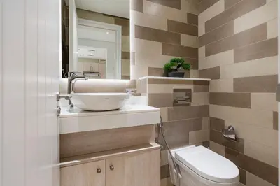 a bathroom with a sink and a toilet at Stylish 1-BR Beachfront Apt on SEVEN PALM Dubai in Dubai