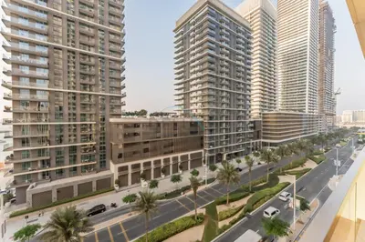 an aerial view of a city with tall buildings at Steps Away From JBR Beach And Marina Promenade, Quick Access To Palm Jumeirah, Surrounded by Leisure And Entertainment Hubs - Marina Vista Tower 2, Emaar Beachfront by Deluxe Holiday Homes in Dubai