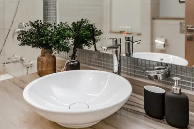 a bathroom with a white sink and a mirror at Luxury Living at Paramount Tower B, Business Bay in Dubai