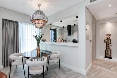 a dining room with a table and chairs at Luxury Living at Paramount Tower B, Business Bay in Dubai