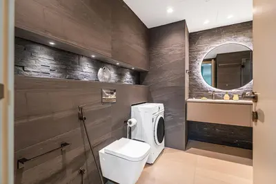 a bathroom with a toilet and a sink and a mirror at Escape24 Luxury 2BR with Large Balcony and Lake Views in Dubai