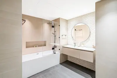 a bathroom with a sink and a mirror at Escape24 Luxury 2BR with Large Balcony and Lake Views in Dubai