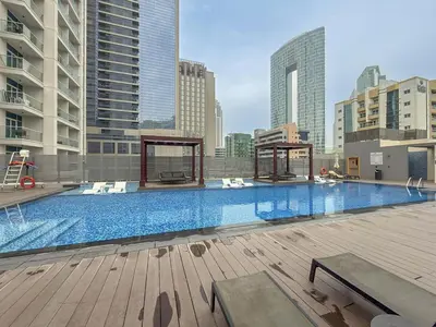 a large swimming pool on top of a building at Chic 2BHK Retreat with Marina Views by Czechin in Dubai