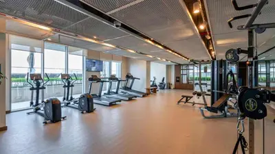 a gym with several treadmills and machines in a room at TRPS - Beach Isle Tower 1, Dubai Harbour - Seaside Residence, Private Beach, Palm View in Dubai