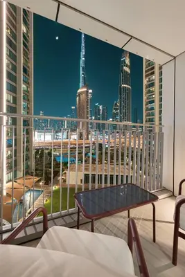 a view of a city skyline from a balcony at Luxury 4BR Burj Khalifa View Dubai Mall in Dubai