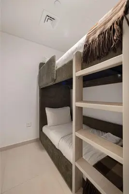 a bunk bed in a room with a bunk bedscribed at Luxury 4BR Burj Khalifa View Dubai Mall in Dubai