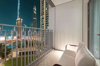 a balcony with a view of a city skyline at Luxury 4BR Burj Khalifa View Dubai Mall in Dubai