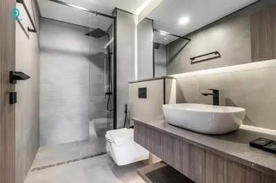 a bathroom with a white sink and a shower at Blue Breeze Cozy 1 BR in JVC Al Serh Residence 11 in Dubai
