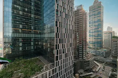 a view of a tall building in a city at 2BR Luxury Hotel Amenities Dubai Mall Access in Dubai