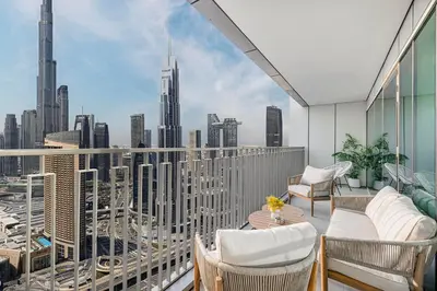 a balcony with chairs and a view of the city at 4Bedroom Luxury Stay in Downtown Views Dubai Mall in Dubai