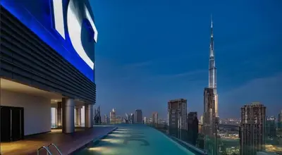 a view of the shard from a building with a swimming pool at Burj Khalifa View High Floor and Brand New in Dubai