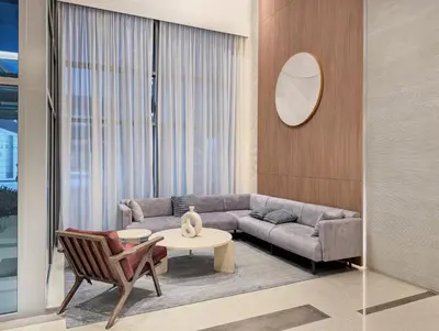 a living room with a couch and a table at Luxury 2BR Downtown Walk to Dubai Mall Burj Khalifa in Dubai