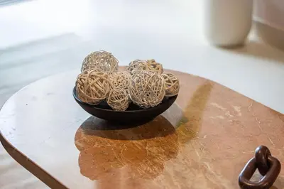 a black bowl filled with balls on a table at 4BR Luxury Hotel Amenities Dubai Mall Access in Dubai