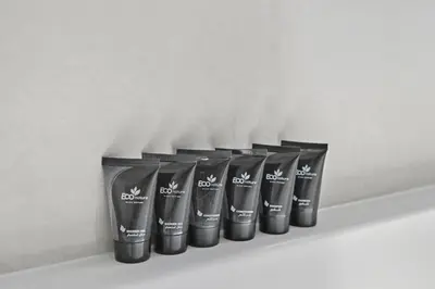 a row of black cups sitting on a shelf at Luxury 1BHK Burj Khalifa View Short Walk Dubai Mall in Dubai