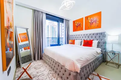 a bedroom with a large bed and a large window at NYC x DXB with Full Burj Khalifa View in Downtown Dubai in Dubai