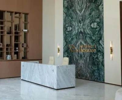 a lobby with a reception desk in a building at Tranquil 1BR in Binghatti Amber with Free Pool & Gym! in Dubai