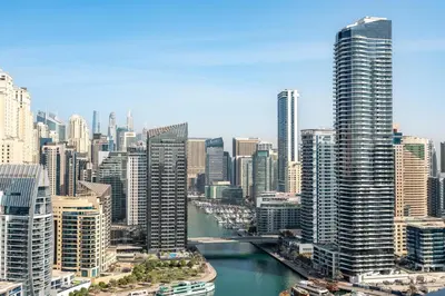 a view of a city with a river and buildings at GuestReady | Studio | Cozy Apt with Marina View in Dubai