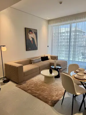 a living room with a couch and a table at Luxury Brand new 2BR nearby DIFC in Dubai
