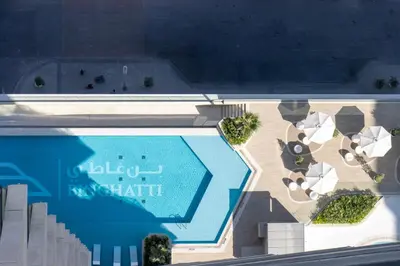 an overhead view of a swimming pool and a resort at Modern 1B with Private Jacuzzi Binghatti Phantom, JVC in Dubai