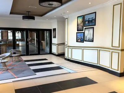 a lobby with a checkered floor at ASHRI HH | Spacious Studio in Arjan in Dubai