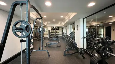a gym with a bunch of equipment in a room at Authentic Arabic Lux Stay -Seconds to Burj Khalifa in Dubai