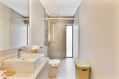 a bathroom with a sink and a shower at MAG City Private Villa, 3BR with Pool, Garden & BBQ in Dubai
