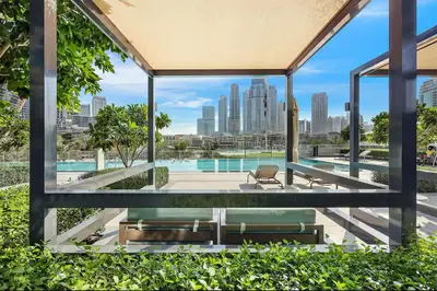 a view of a pool from a building at Luxury 1Bedroom Burj Khalifa View from Infinity Pool Grande Signature Residences in Dubai