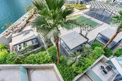 an aerial view of a resort with a palm tree at Sleek Home in Business Bay with Panoramic Views in Dubai