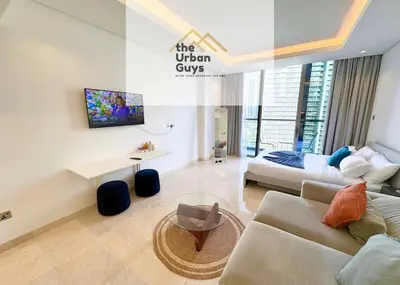 a living room with a couch and a table at Livo in Dubai