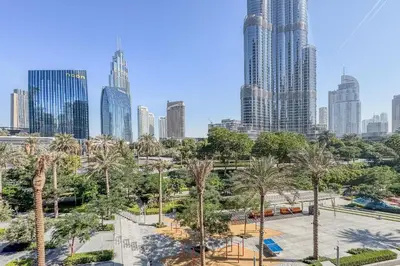 a view of a city with palm trees and buildings at High-End 2Bedroom Near Dubai Opera & Mall in Dubai