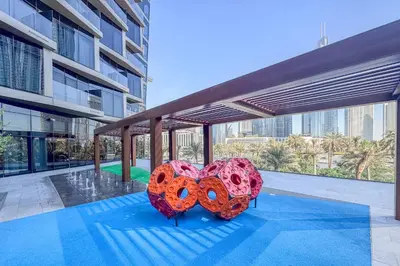 two heart shaped umbrellas sitting on top of a building at High-End 2Bedroom Near Dubai Opera & Mall in Dubai