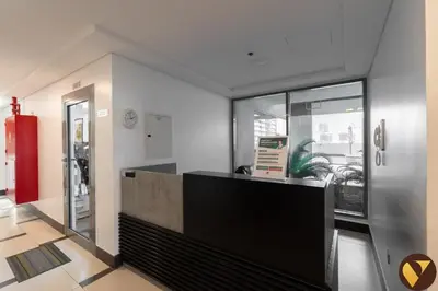 a lobby with a reception desk in a building at Vogue JVC Jeewar Tower Near Circle Mall, One Bedroom Apartment with Balcony and City View, Access to all Amenities in Dubai