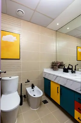 a bathroom with a toilet and a sink at Waves - Vibrant JLT Stay - Modern Funky Studio in Dubai