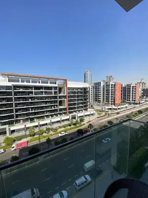 a view of a city with buildings and a street at Bright Studio - Azizi Riviera 35 - Fully Furnished in Dubai