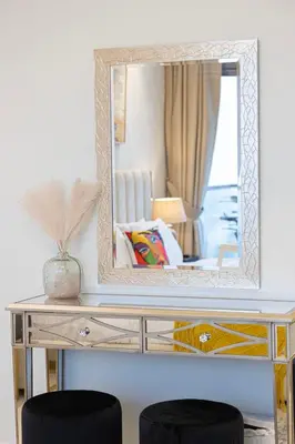 a mirror on top of a desk in a room at Burj Khalifa View II Luxury HIGH Floor whith Pool&Spa in Dubai