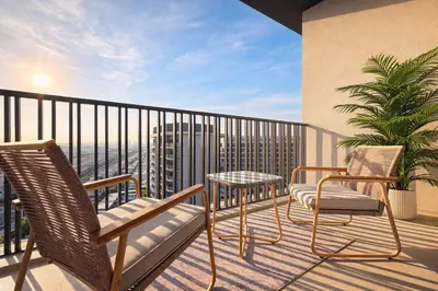 a balcony with two chairs and a table on a balcony at Designer Studio near Downtown & Dubai Mall in Dubai
