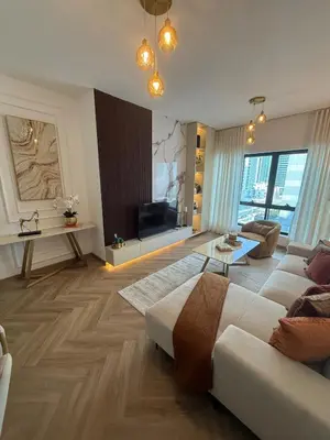 a large living room with a couch and a table at Stylish 1BR in Dubai Marina,Walk to JBR in Dubai