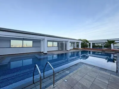 a swimming pool in front of a house at DIFC Sky Gardens Studio In front of DIFC Gate in Dubai
