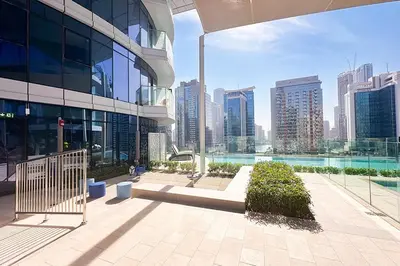a building with a view of a city with tall buildings at Luxury 3BR Imperial Avenue Burj Khalifa Views in Dubai