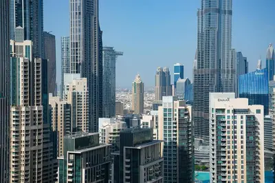 a view of a large city with tall buildings at Luxury 3BR Imperial Avenue Burj Khalifa Views in Dubai
